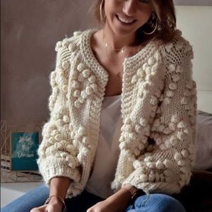 Adorable cardigan in size medium. Brand new, cream